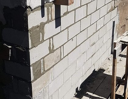 new wall rebuilt and poured inside blocks with portland cement